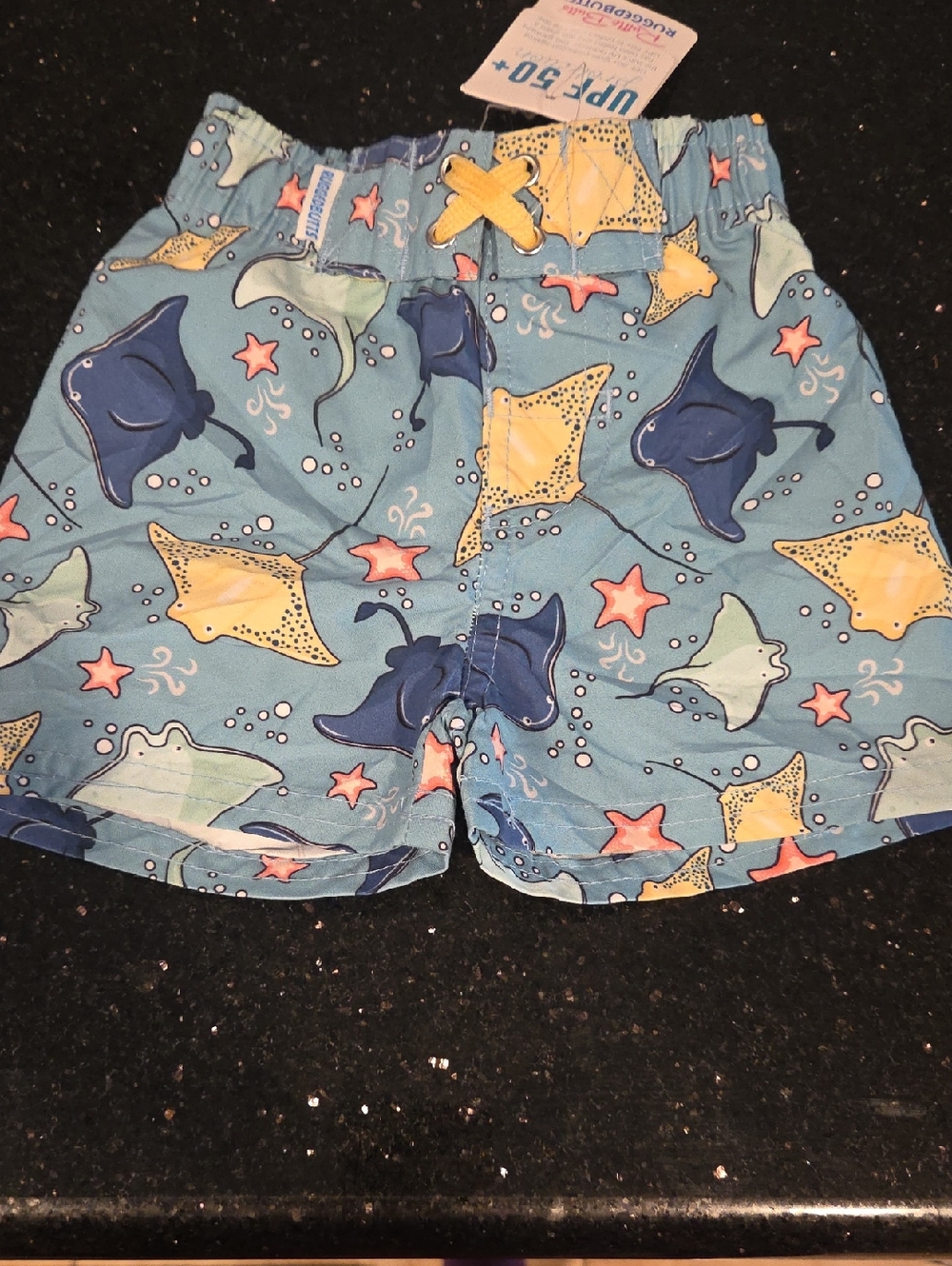 Ruffle Butts Blue Swim Trunks with Yellow Tie and Ocean Life Print NWT